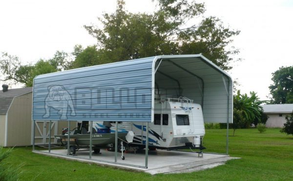 Metal RV cover with RV parked underneath.