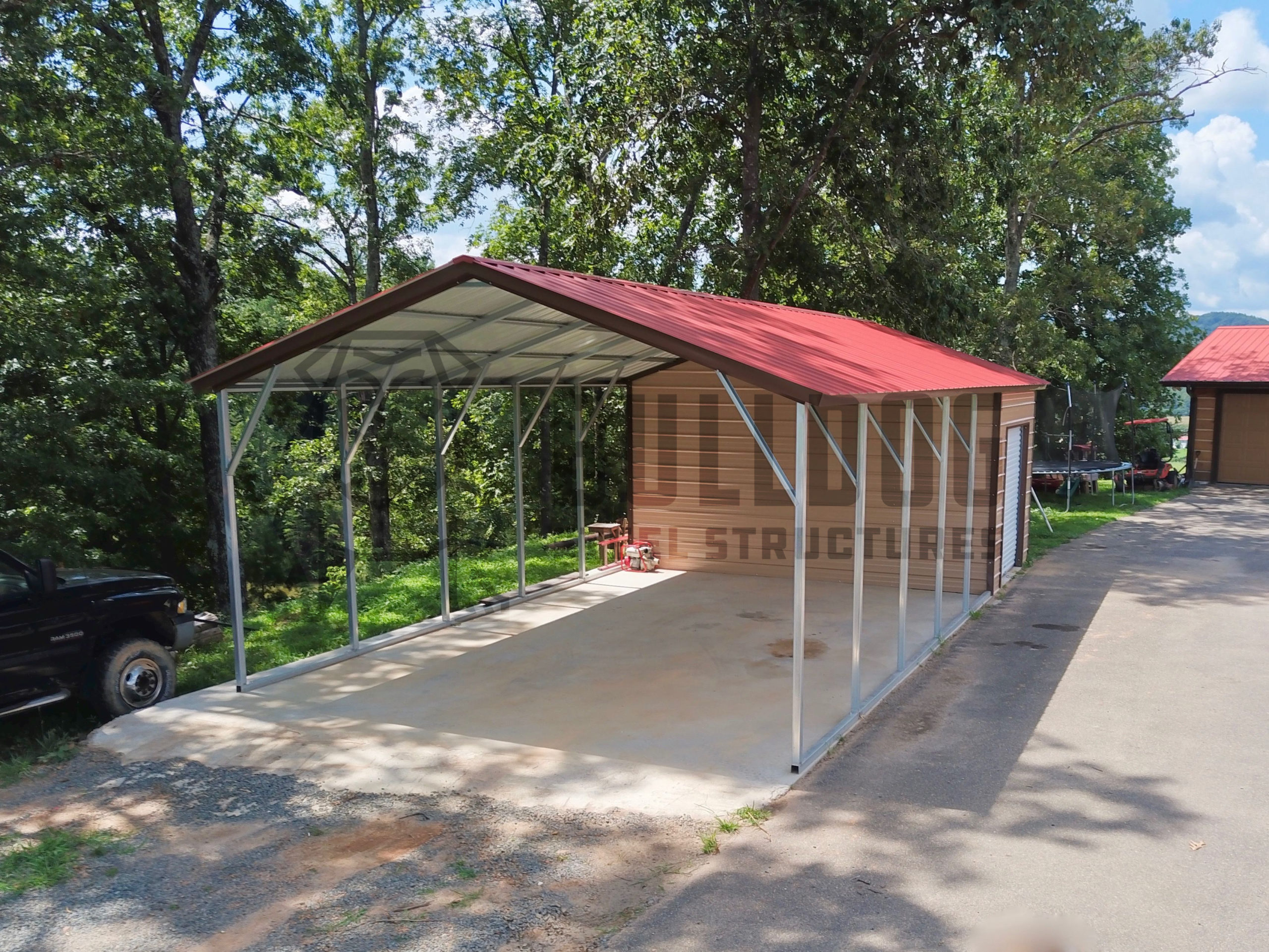 Car port with red roof with attached storage shed