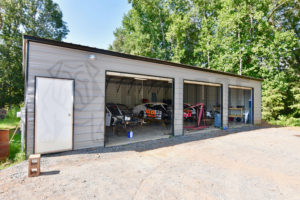 custom metal garage with cars inside