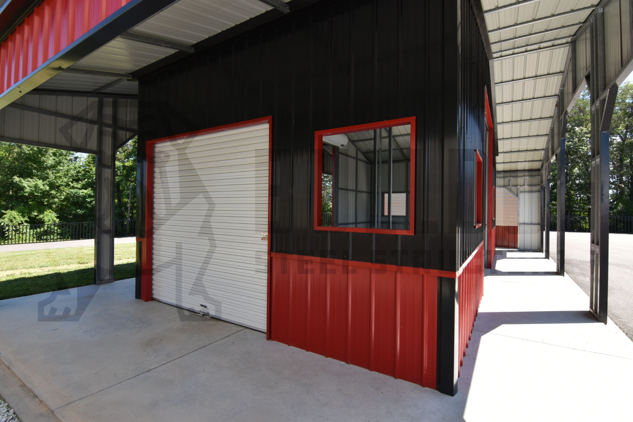 Close up of exterior of custom red barn with black trim