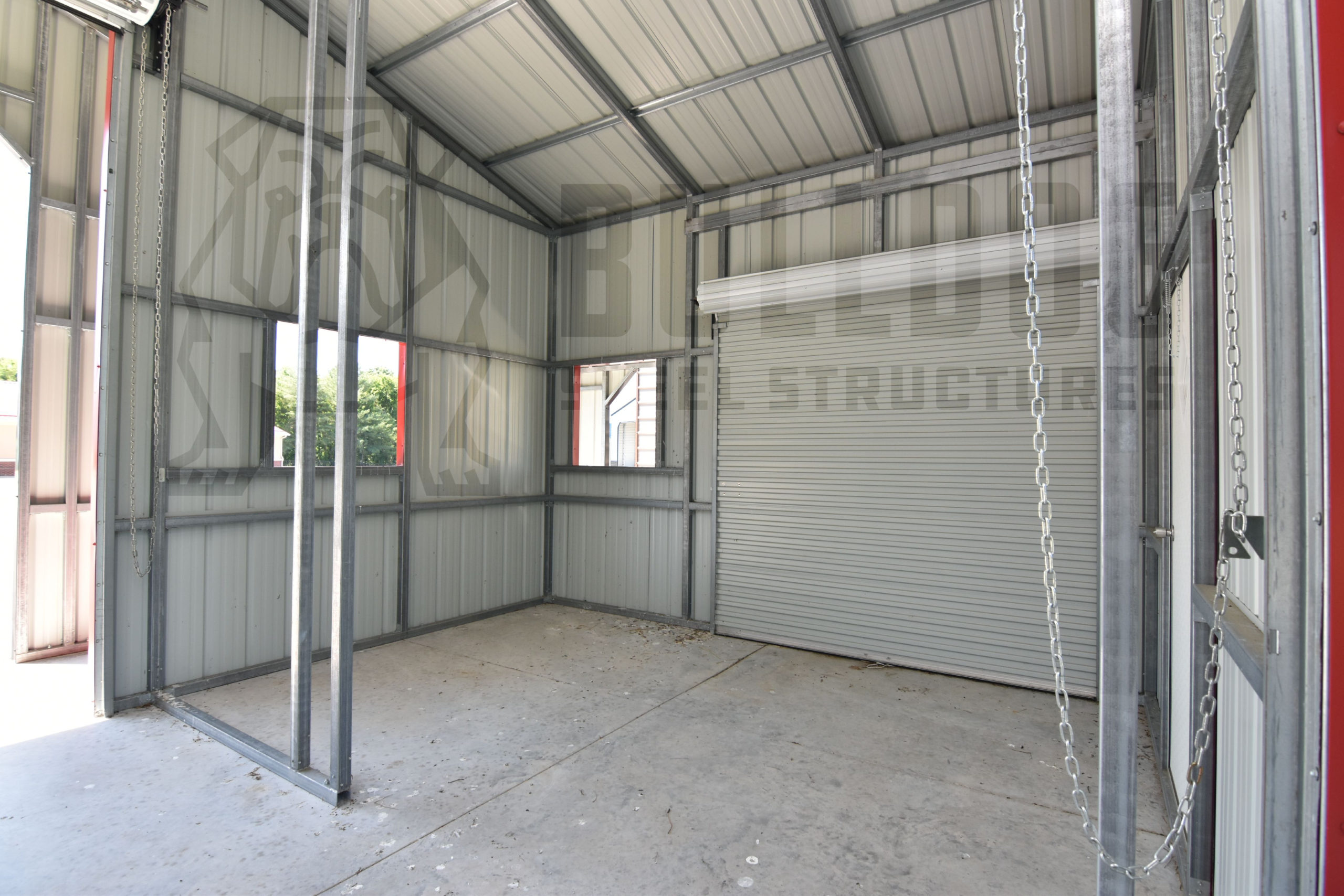 Interior of metal barn with red trim