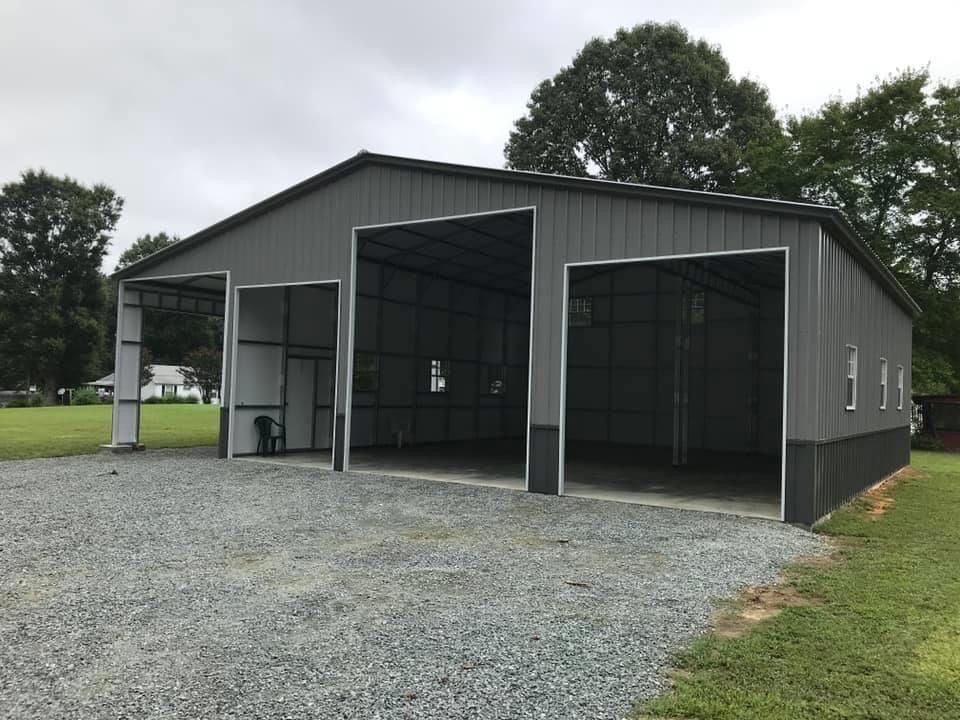 all gray custom meta barn with vertical siding