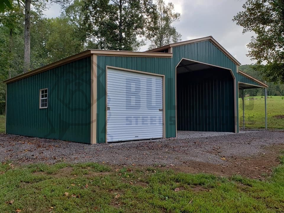 Exterior of barn with green walls and car port attached