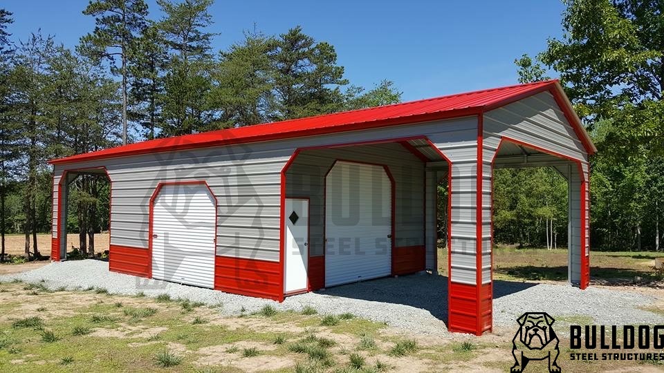 Red and beige metal building with 2 garage doors